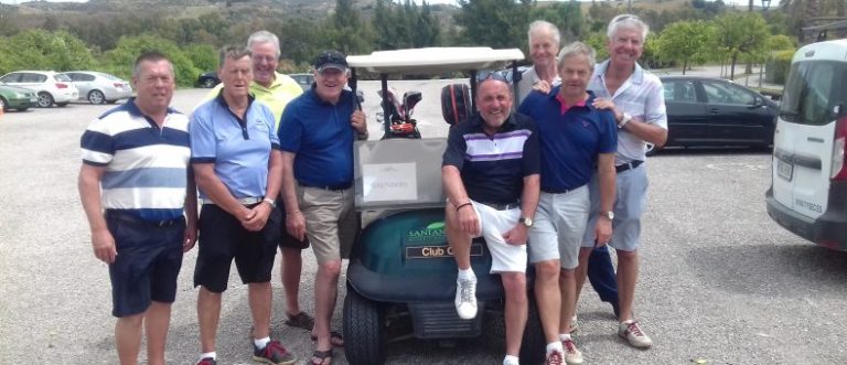 Golfers having their photo taken with golf cart on their Spanish golf holiday.