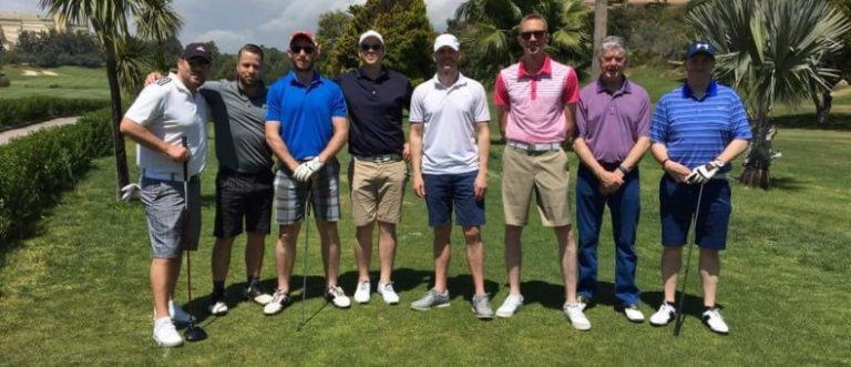 The Stuart McCormack group posing for a group shot prior to their round.