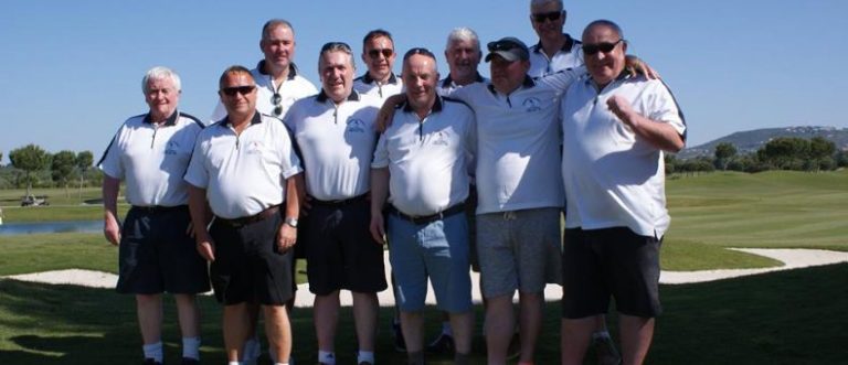 The Vincent Cooney group all dressed in white shirts posing for their group shot prior to teeing off.