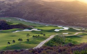 The Calanova Golf course with a green guarded by bunkers.