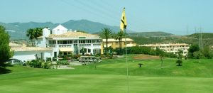 One of the holes at Miraflores Golf with clubhouse in the background.