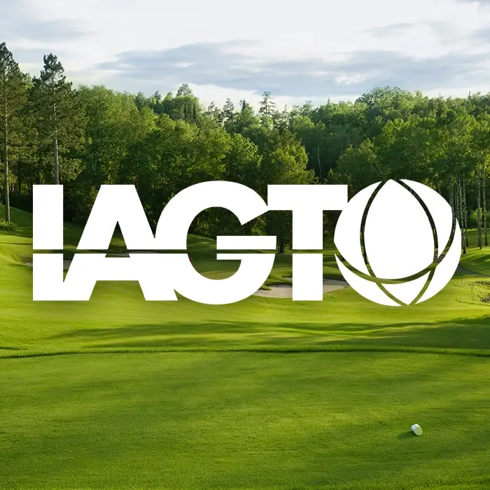 Image of a golf course fairway and green with the words IAGTO in the foreground in white.