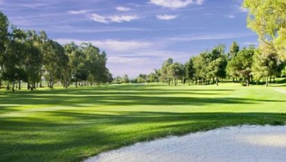 One of the fairways at the Atalaya Old course on the Costa del Sol with bunker in the foreground.